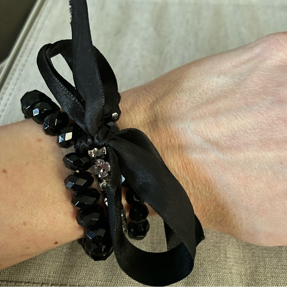 Set of 3 bracelets 2 black 1 silver with diamond studs with a cute black ribbon